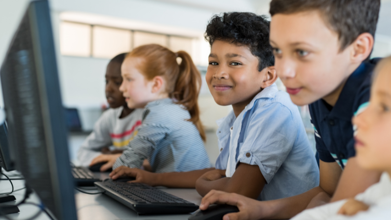 school kids working at computers